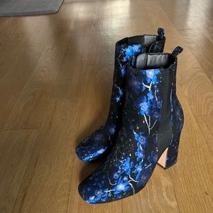 Black block heel boots with blue embroidery
